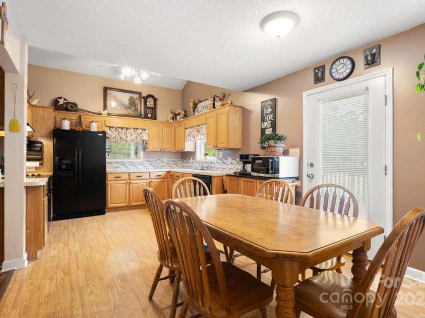 3451 Greene Road, Monroe, NC 28110.  MLS# CAR4271557, YatesRealty ID 23327. Dining room to easily accomodate six seats