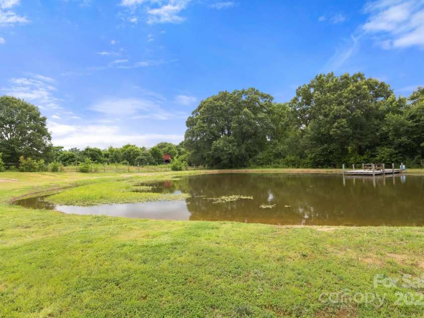3451 Greene Road, Monroe, NC 28110.  MLS# CAR4271557, YatesRealty ID 23327. Enjoy the fully stocked pond with generously sized Dock
