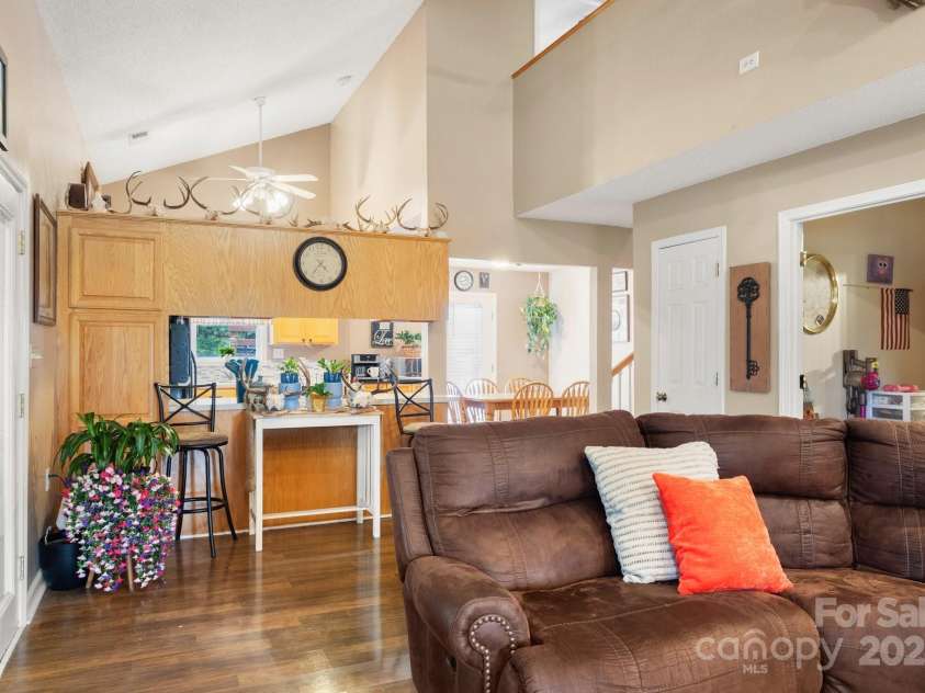 3451 Greene Road, Monroe, NC 28110.  MLS# CAR4271557, YatesRealty ID 23327. Living Room opens to the kitchen and dining area
