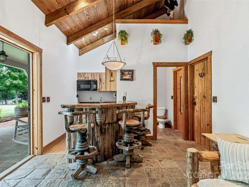 1987 Rabbit Hop Road, Spruce Pine, NC 28777.  MLS# CAR4270357, YatesRealty ID 23328. Studio apartment in the stable with a full bathroom and kitchenette.