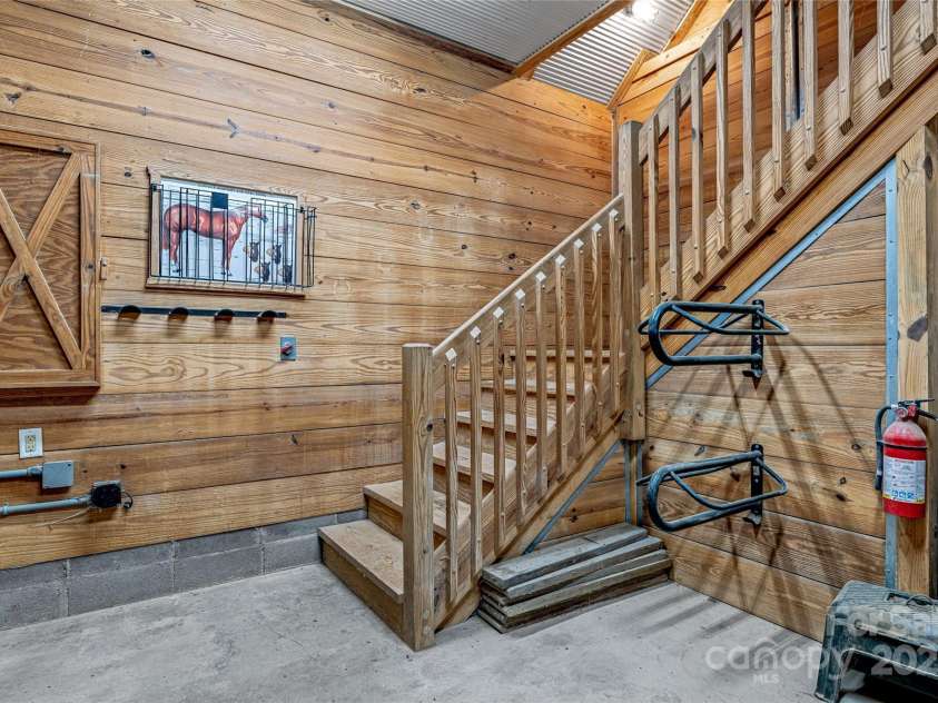 1987 Rabbit Hop Road, Spruce Pine, NC 28777.  MLS# CAR4270357, YatesRealty ID 23328. The Tack Room with stairs to the hay loft above Barn