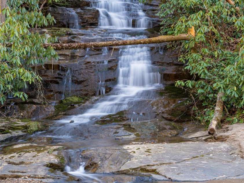 1987 Rabbit Hop Road, Spruce Pine, NC 28777.  MLS# CAR4270357, YatesRealty ID 23328. Waterfall that flows into Crabtree Creek.