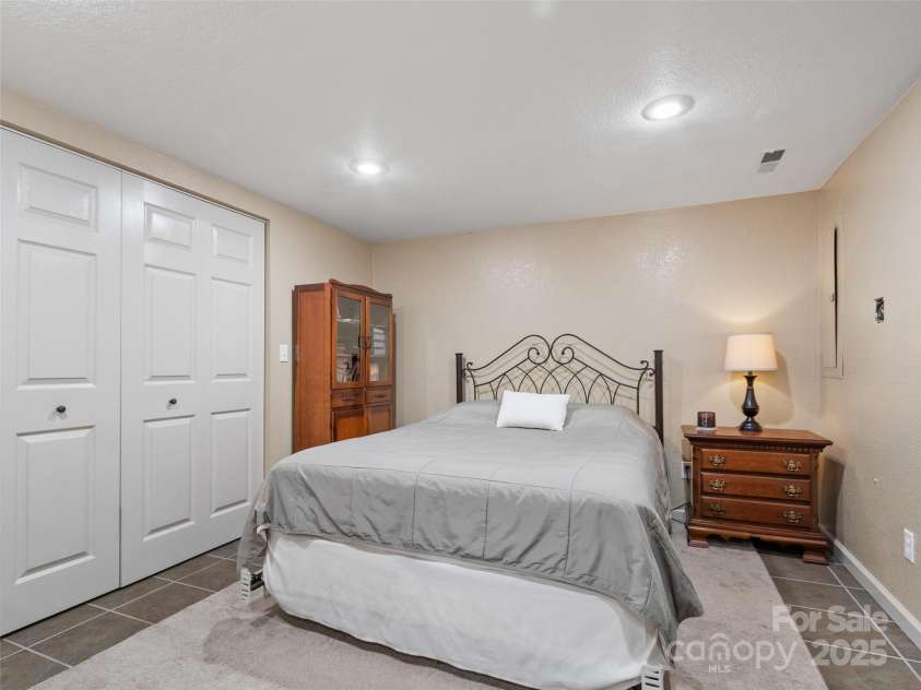 189 Poverty Branch Road, Barnardsville, NC 28709.  MLS# CAR4276020, YatesRealty ID 23331. Bed/flex room in basement