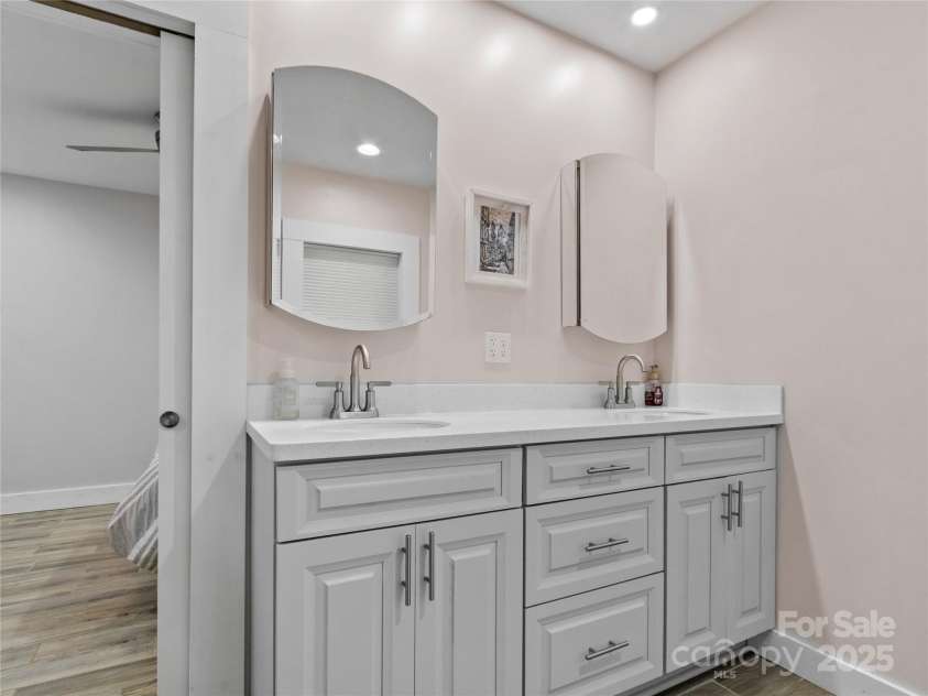 47 Old Chimney Drive, Burnsville, NC 28714.  MLS# CAR4269340, YatesRealty ID 23334. Double vanities in primary bedroom