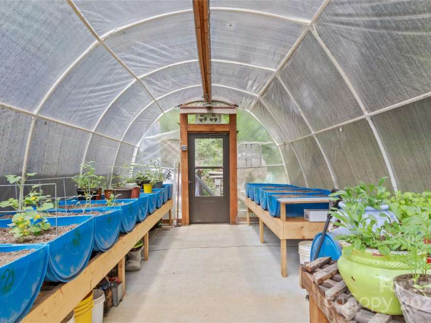 47 Old Chimney Drive, Burnsville, NC 28714.  MLS# CAR4269340, YatesRealty ID 23334. Greenhouse set up with rainwater irrigation system