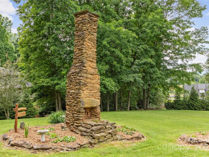 47 Old Chimney Drive, Burnsville, NC 28714.  MLS# CAR4269340, YatesRealty ID 23334. This is where Old Chimney Dr gets its name. Stone chimney left from original cabin built approx. 100 years ago
