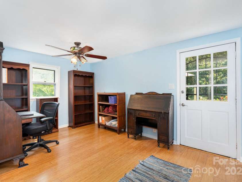 4124 Oakwood Road, Charlotte, NC 28269.  MLS# CAR4276165, YatesRealty ID 23335. Bedroom 2 with exit to deck and pool area. Currently used as an office.