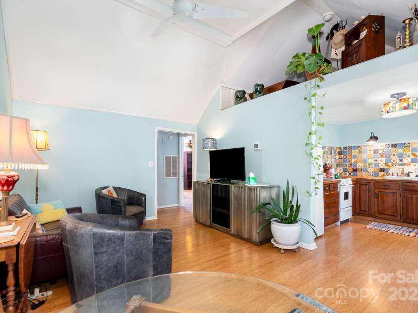 4124 Oakwood Road, Charlotte, NC 28269.  MLS# CAR4276165, YatesRealty ID 23335. Inviting living room with decorative loft