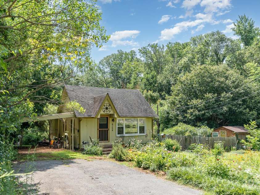 4124 Oakwood Road, Charlotte, NC 28269.  MLS# CAR4276165, YatesRealty ID 23335. Wide driveway with carport