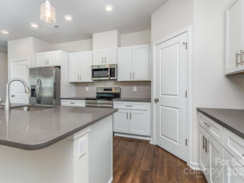 2055 Sadler Woods Lane, Charlotte, NC 28214.  MLS# CAR4265583, YatesRealty ID 23337. Side serving area. Representational Photo.