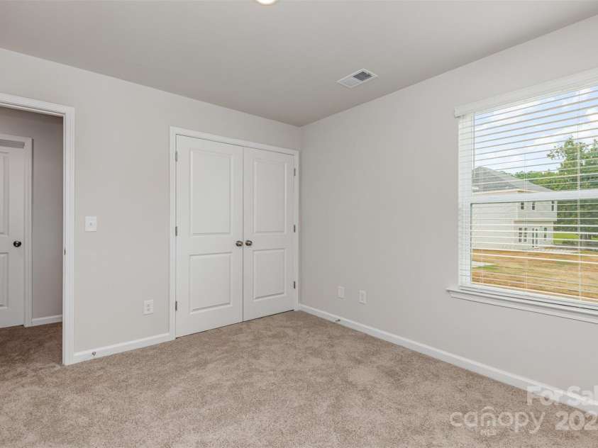 2055 Sadler Woods Lane, Charlotte, NC 28214.  MLS# CAR4265583, YatesRealty ID 23337. Spare Bedroom 1. Representational Photo.
