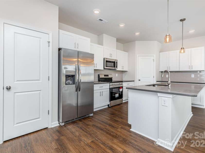 2055 Sadler Woods Lane, Charlotte, NC 28214.  MLS# CAR4265583, YatesRealty ID 23337. Stainless steel appliances. Representational Photo.