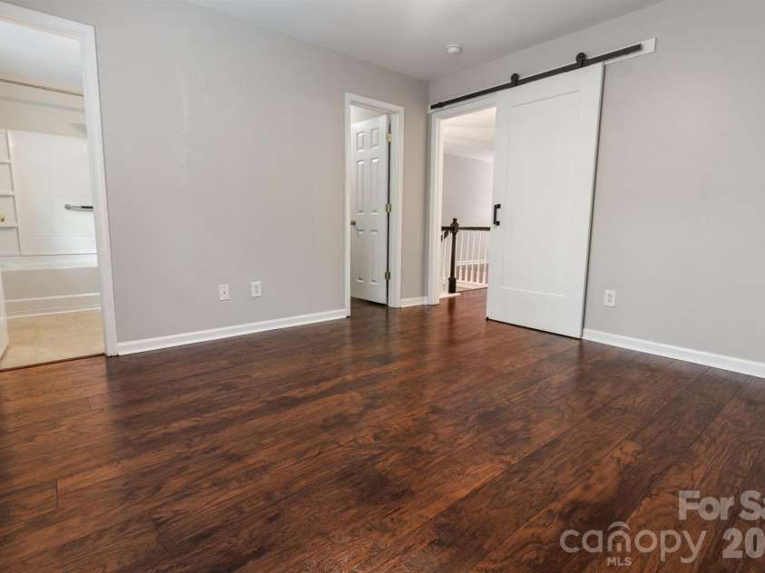 407 Delta Drive, Fort Mill, SC 29715.  MLS# CAR4365600, YatesRealty ID 23339. Primary bedroom