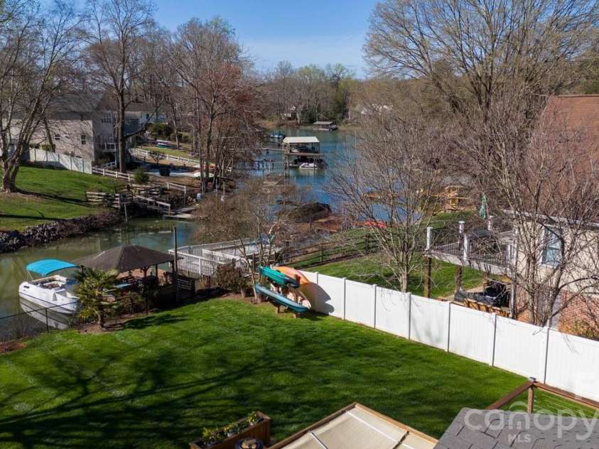 141 Bluewing Lane, Mooresville, NC 28117.  MLS# CAR4381743, YatesRealty ID 23352. Lakeview from backyard