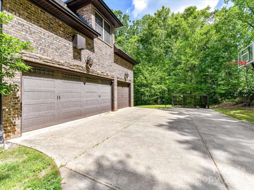 633 Elmhurst Drive, Fort Mill, SC 29715.  MLS# CAR4245784, YatesRealty ID 23352. 3 car garage, side facing