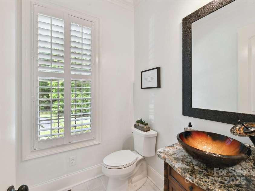 633 Elmhurst Drive, Fort Mill, SC 29715.  MLS# CAR4245784, YatesRealty ID 23352. Main level half bath