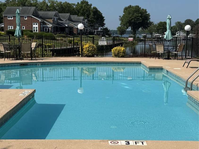 18511 Harborside Drive, Cornelius, NC 28031.  MLS# CAR4274110, YatesRealty ID 23355. Pool Overlooking Lake