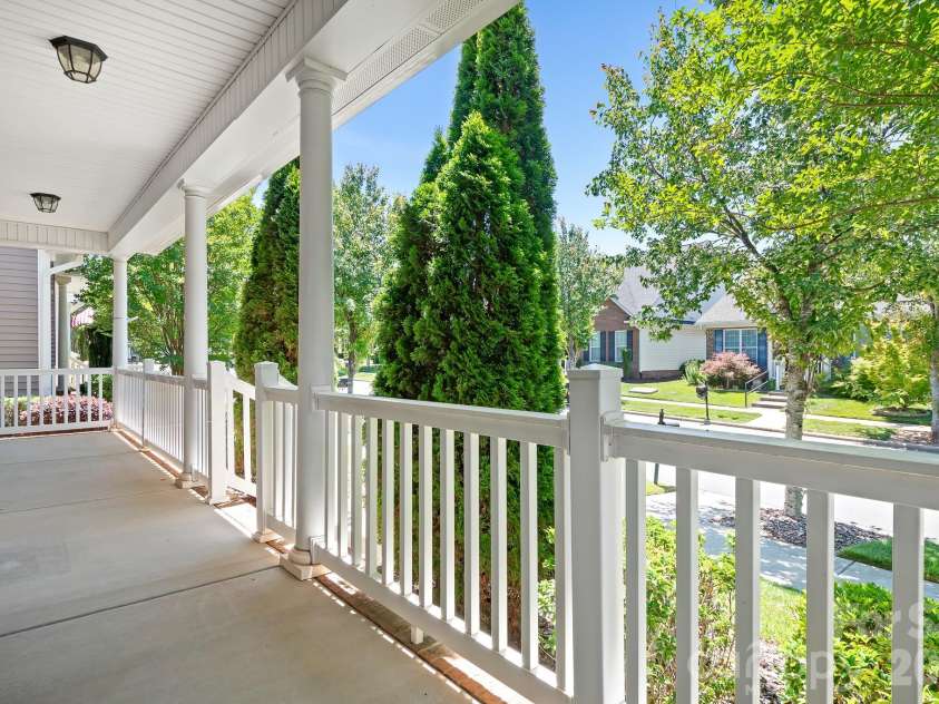 17721 Morehampton Avenue, Cornelius, NC 28031.  MLS# CAR4382390, YatesRealty ID 23358. Inviting Rocking Chair front porch