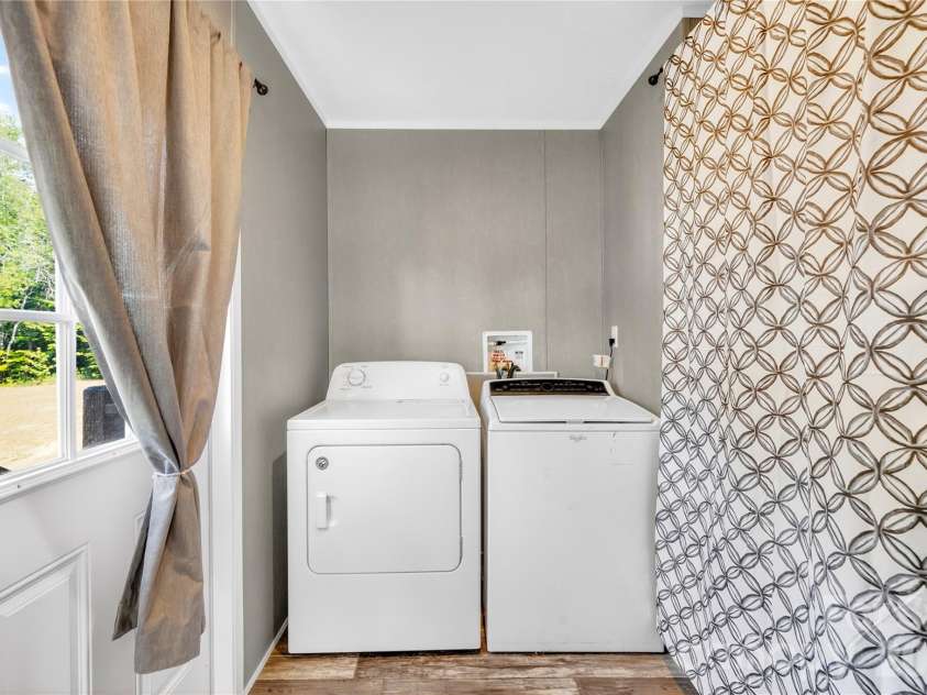 171 Brook Creek Drive, Troutman, NC 28166.  MLS# CAR4381849, YatesRealty ID 23361. Laundry room off Kitchen