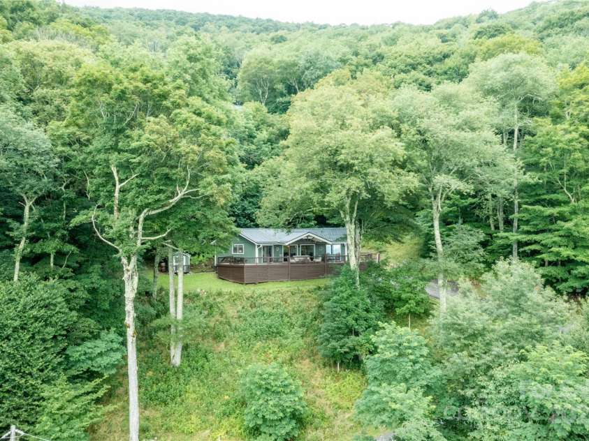 423 Grouse Thicket Road, Mars Hill, NC 28754.  MLS# CAR4220516, YatesRealty ID 23361. Aerial view of the property and surrounding landscape