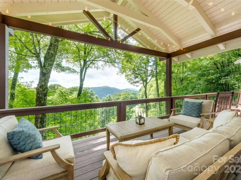 423 Grouse Thicket Road, Mars Hill, NC 28754.  MLS# CAR4220516, YatesRealty ID 23361. Gorgeous covered deck w/ year-round mountain views