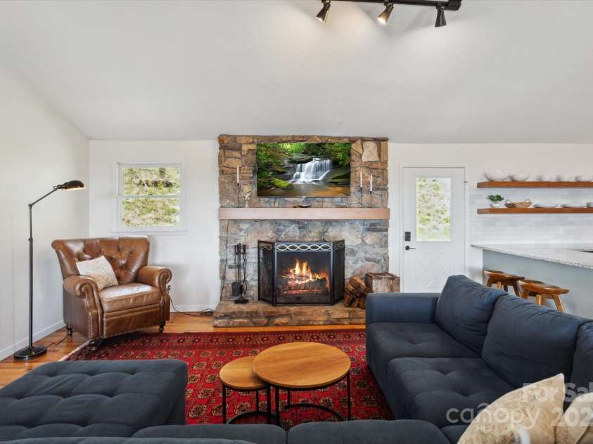 423 Grouse Thicket Road, Mars Hill, NC 28754.  MLS# CAR4220516, YatesRealty ID 23361. Open floor plan + vaulted ceilings + stone fireplace