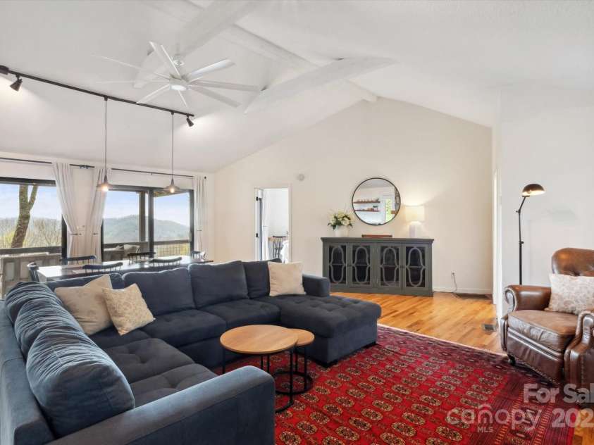 423 Grouse Thicket Road, Mars Hill, NC 28754.  MLS# CAR4220516, YatesRealty ID 23361. Open floor plan + vaulted ceilings + stone fireplace