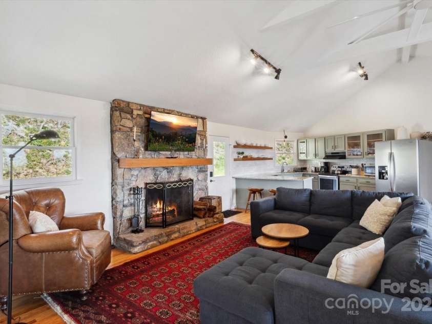 423 Grouse Thicket Road, Mars Hill, NC 28754.  MLS# CAR4220516, YatesRealty ID 23361. Open floor plan + vaulted ceilings + stone fireplace