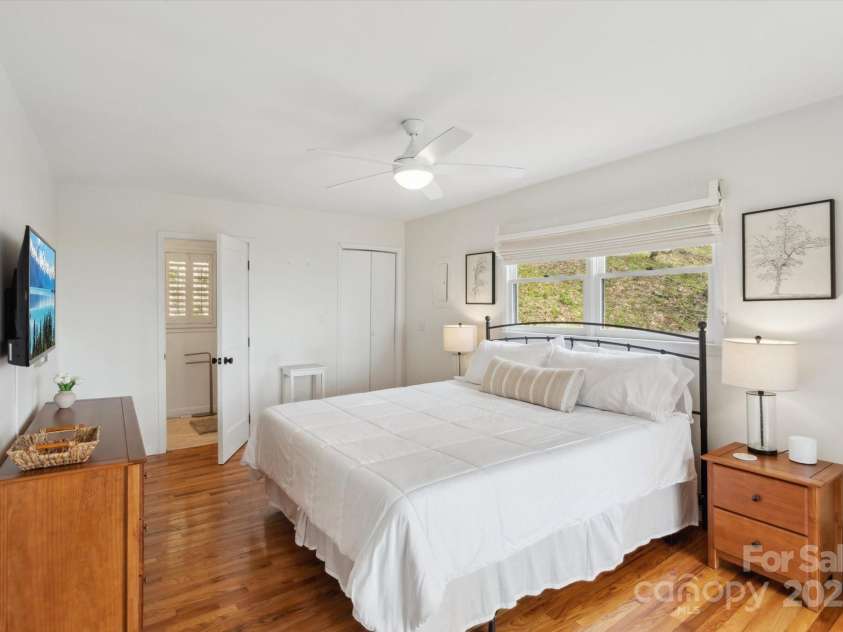 423 Grouse Thicket Road, Mars Hill, NC 28754.  MLS# CAR4220516, YatesRealty ID 23361. Primary Bedroom w/ ensuite bathroom