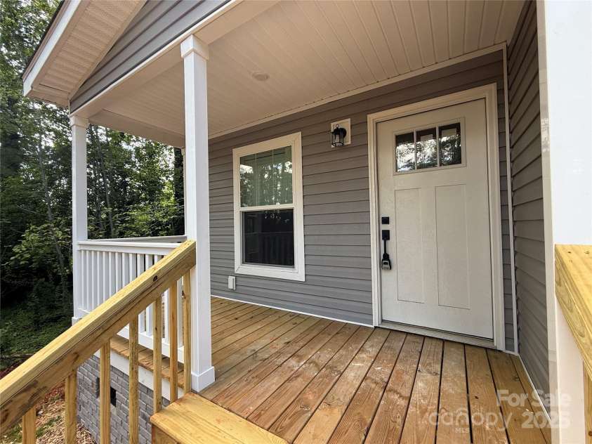 55 Cypress Road, Marion, NC 28752.  MLS# CAR4261438, YatesRealty ID 23362. Covered side porch