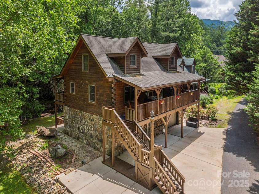 15 Breezy Creek Lane, Maggie Valley, NC 28751.  MLS# CAR4279649, YatesRealty ID 2337. Custom creekfront log home