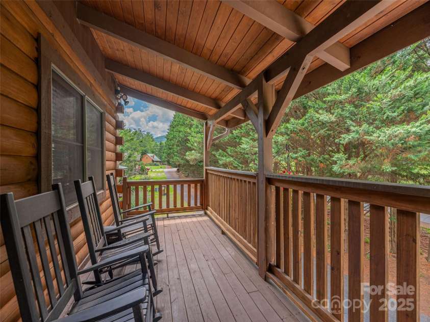 15 Breezy Creek Lane, Maggie Valley, NC 28751.  MLS# CAR4279649, YatesRealty ID 2337. Full length covered front deck