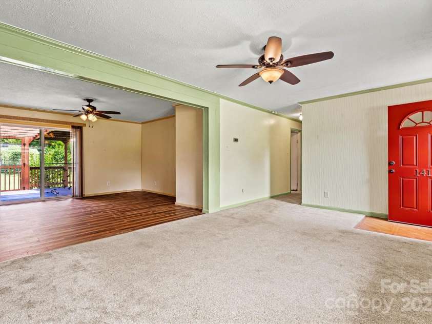 141 Porter Road, Statesville, NC 28625.  MLS# CAR4263892, YatesRealty ID 23373. Living room opens to dining area and kitchen.