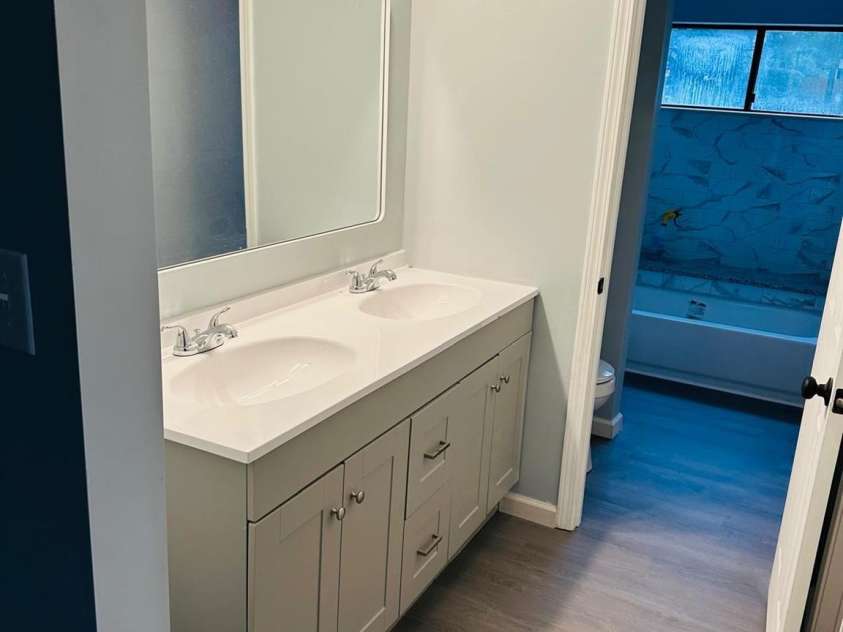 8029 Cedar Glen Drive, Charlotte, NC 28212.  MLS# CAR4382249, YatesRealty ID 23377. Bath view from bedroom