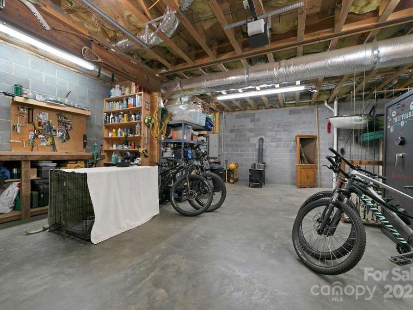 68 Sherwood Village Court, Brevard, NC 28712.  MLS# CAR4232497, YatesRealty ID 2338. Basement Workshop
