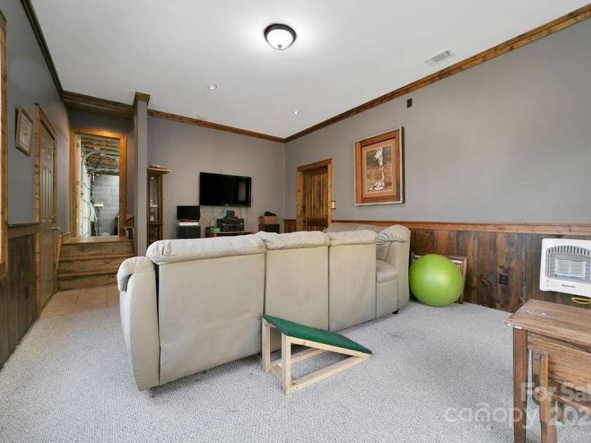 68 Sherwood Village Court, Brevard, NC 28712.  MLS# CAR4232497, YatesRealty ID 2338. Den in Basement