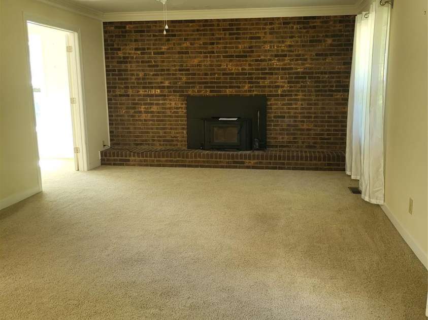 1913 Lake Monroe Drive, Monroe, NC 28112.  MLS# CAR4382343, YatesRealty ID 23380. Living room with fireplace
