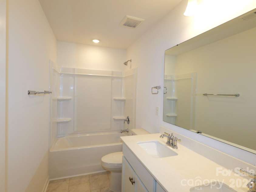 1414 Bucknell Street, Wingate, NC 28174.  MLS# CAR4382345, YatesRealty ID 23386. Secondary bathroom