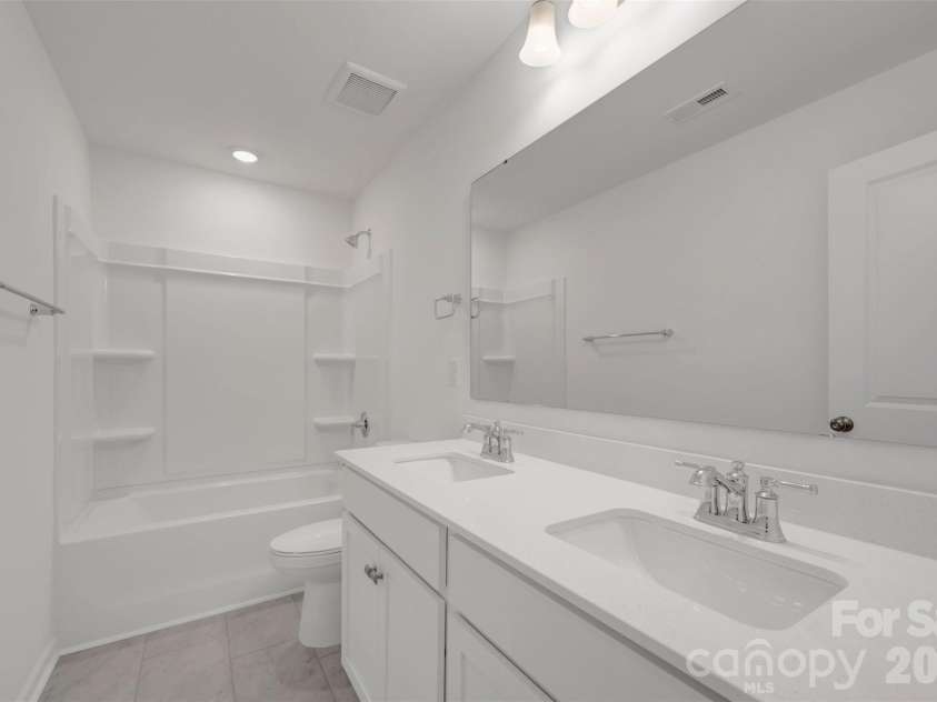 1414 Bucknell Street, Wingate, NC 28174.  MLS# CAR4382345, YatesRealty ID 23386. Secondary bathroom