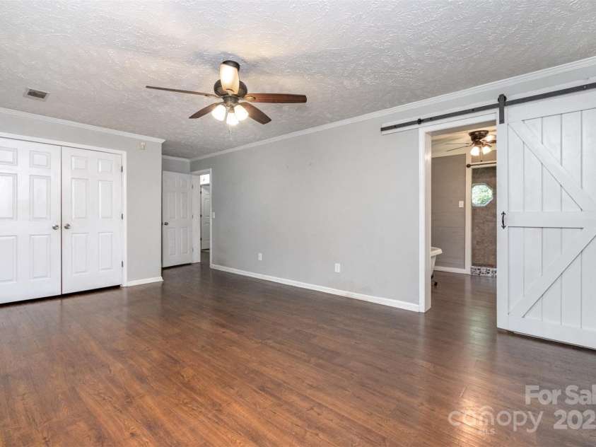 6811 Kluttz Road, Concord, NC 28025.  MLS# CAR4272402, YatesRealty ID 23387. Primary Bedroom (main level)