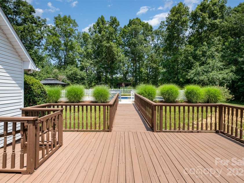 6811 Kluttz Road, Concord, NC 28025.  MLS# CAR4272402, YatesRealty ID 23387. Rear Deck