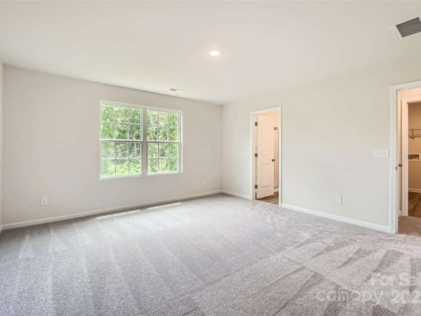 136 Dorian Place, Troutman, NC 28166.  MLS# CAR4272157, YatesRealty ID 23389. Primary Bedroom