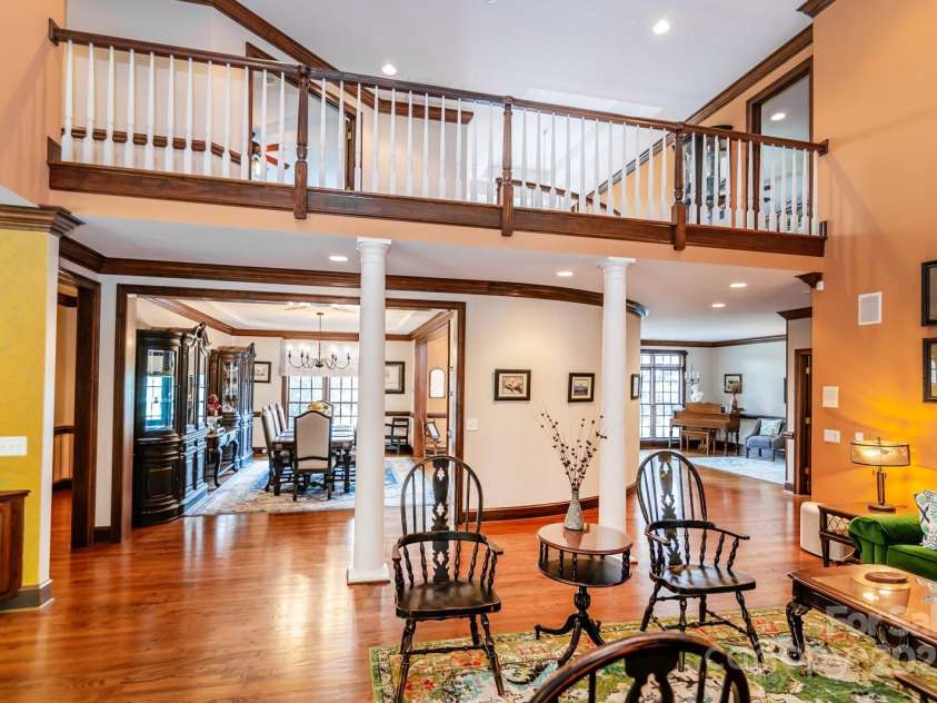 1720 Mills Harris Road, Wingate, NC 28174.  MLS# CAR4254927, YatesRealty ID 23395. Living Area with view of Dining Room, Sitting Room & Upstairs Hallway