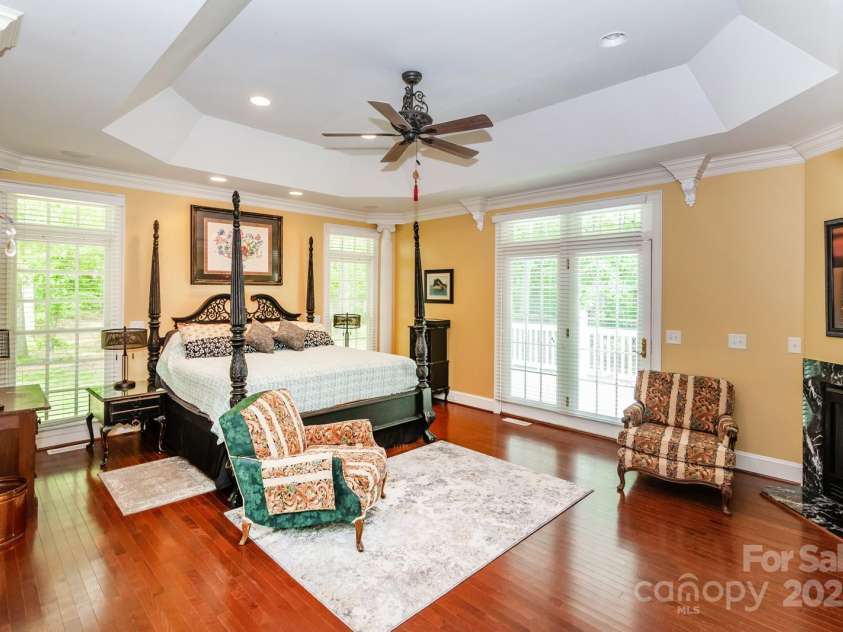 1720 Mills Harris Road, Wingate, NC 28174.  MLS# CAR4254927, YatesRealty ID 23395. Primary Bedroom Suite with Fireplace