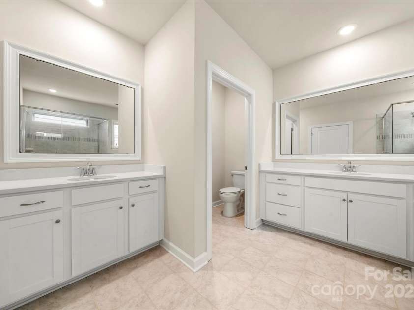 17028 River Race Drive, Huntersville, NC 28078.  MLS# CAR4259977, YatesRealty ID 23397. Double vanities in primary bathroom