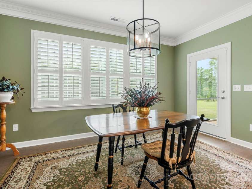 17028 River Race Drive, Huntersville, NC 28078.  MLS# CAR4259977, YatesRealty ID 23397. Eating area and door to screened-in porch