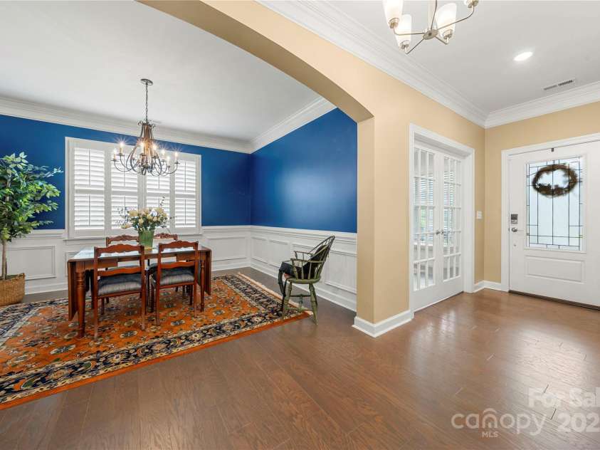 17028 River Race Drive, Huntersville, NC 28078.  MLS# CAR4259977, YatesRealty ID 23397. Formal dining room features chair rail molding, shadowbox trim, and an upgraded chandelier