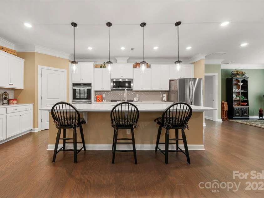 17028 River Race Drive, Huntersville, NC 28078.  MLS# CAR4259977, YatesRealty ID 23397. Kitchen island with new pendant lighting