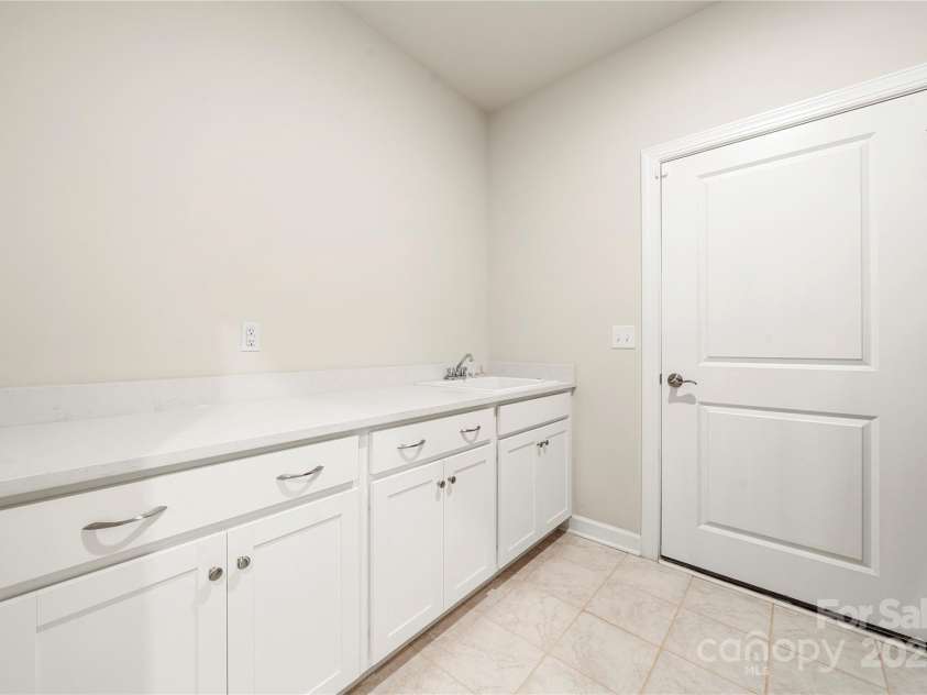 17028 River Race Drive, Huntersville, NC 28078.  MLS# CAR4259977, YatesRealty ID 23397. Laundry room/drop off area features lots of cabinets, sink and counter space
