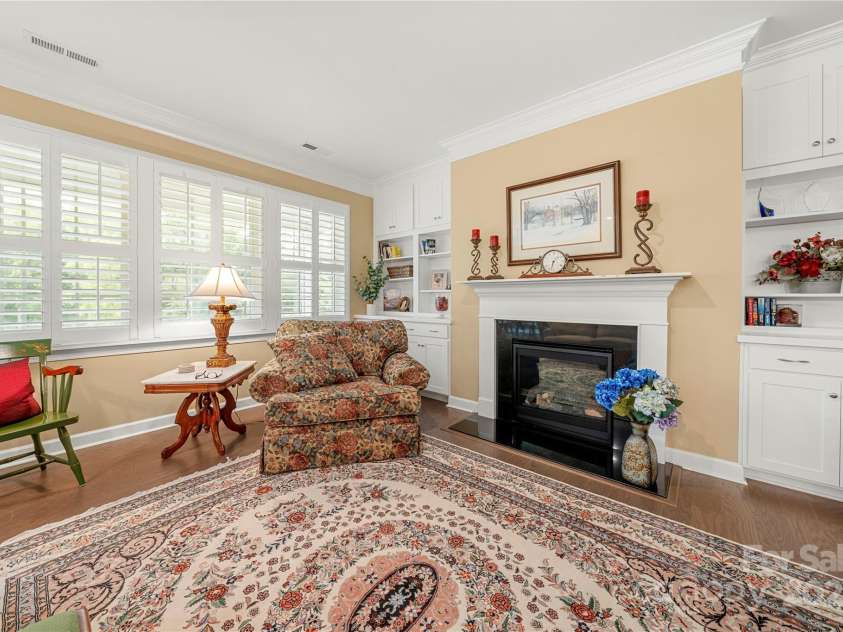 17028 River Race Drive, Huntersville, NC 28078.  MLS# CAR4259977, YatesRealty ID 23397. Living room with marble-topped fireplace mantle